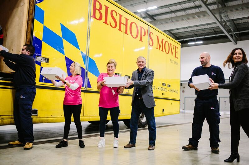 Staff from Bishop’s Moves Solent loading the charity boxes