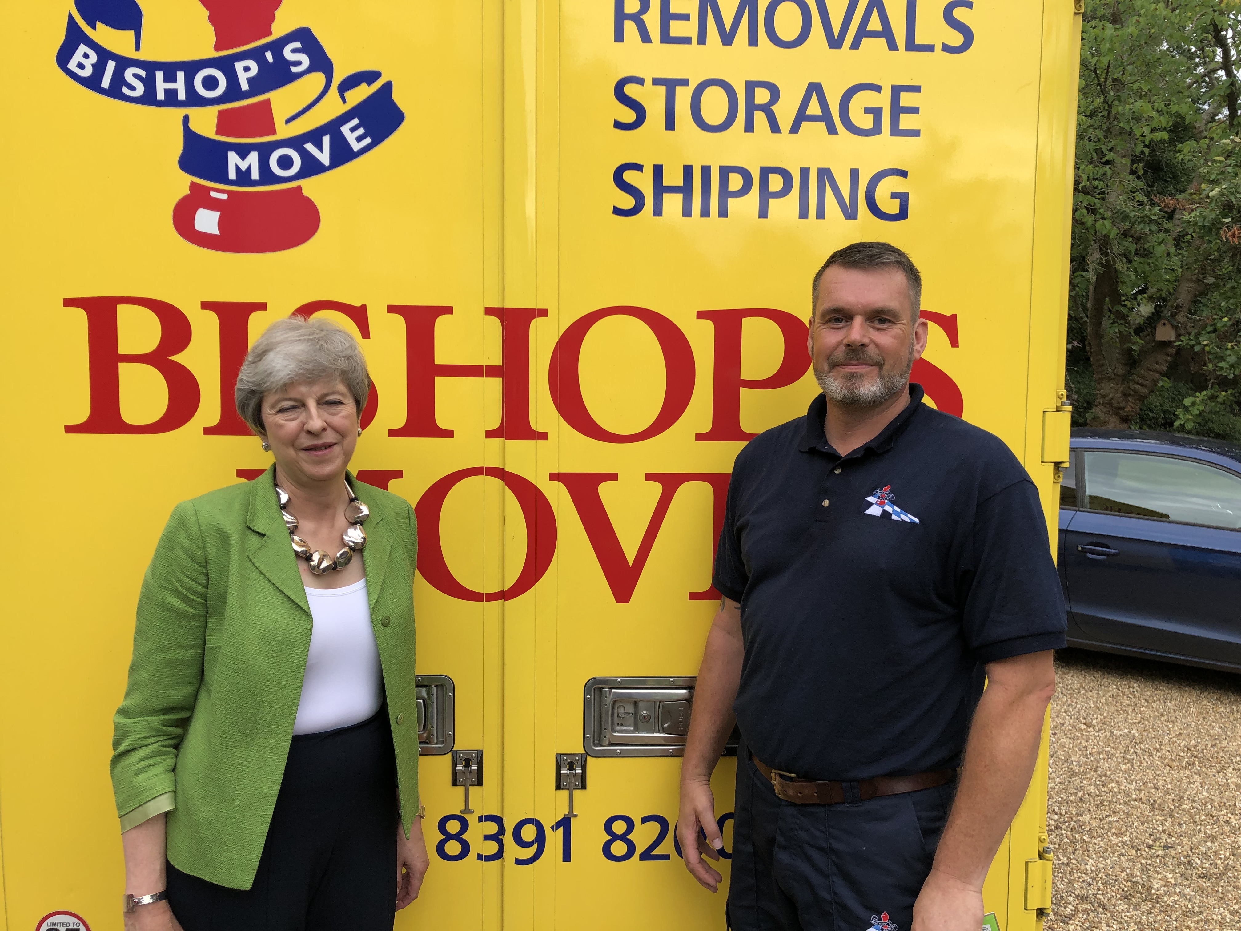Bishop's foreman Mark Allen with Theresa May