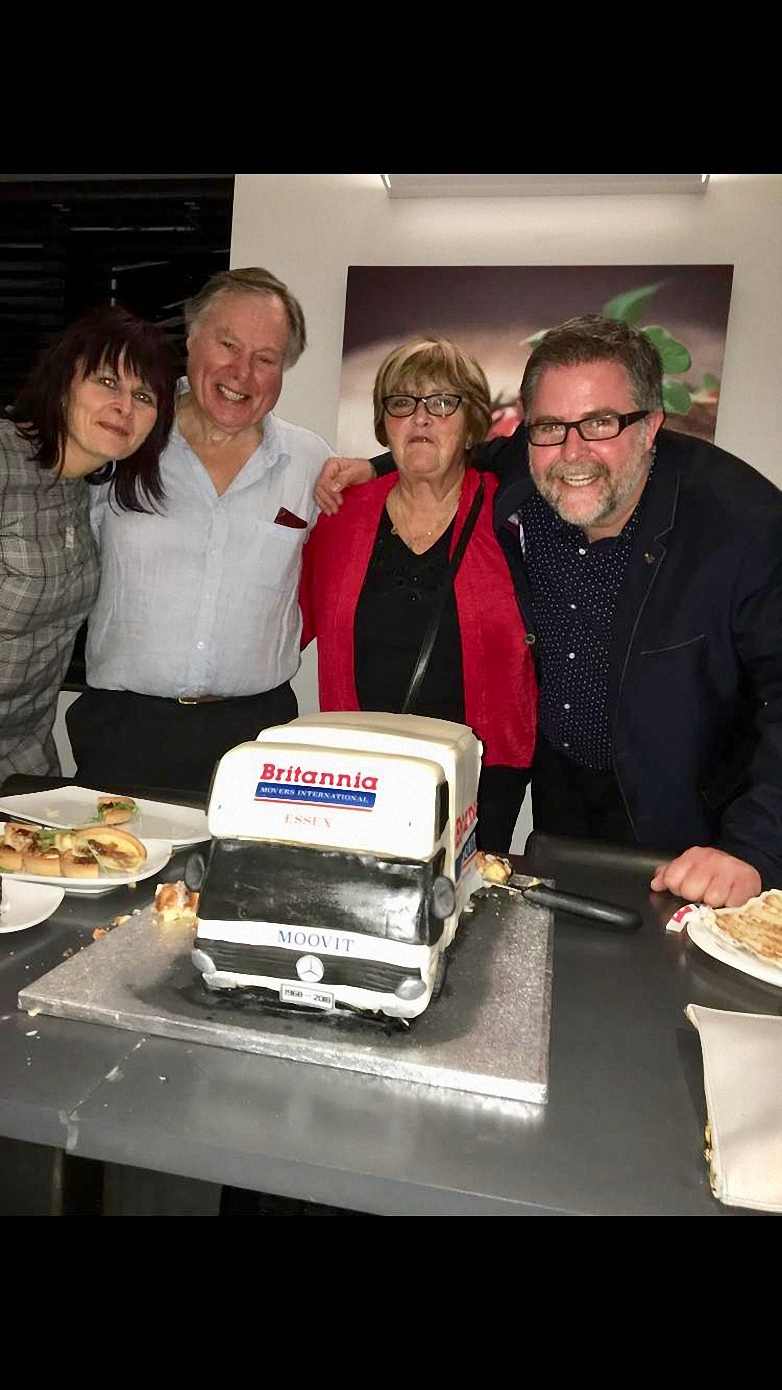 Jo Jopson, John Wicks, Christine Wicks and Tom Wicks with the celebration cake