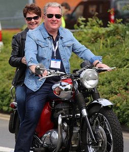 BAR President, Ian Palmer on a BSA 650 A65 Thunderbolt motorcycle, owned by Paul Fox, with his wife Sandra riding pillion.