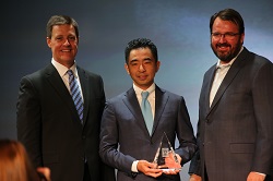 Taro Tominaga accepts the Hall of Honor award on behalf of his father Koji