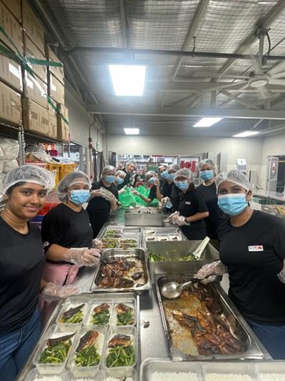 Smart Relocators staff joined volunteers at a local charity that operates a soup kitchen